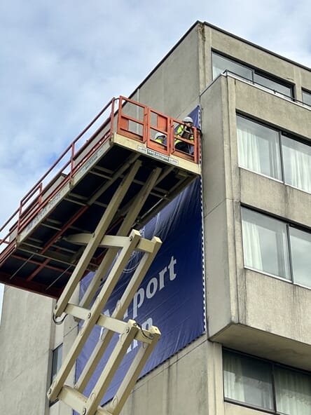An image of exterior sign installation.